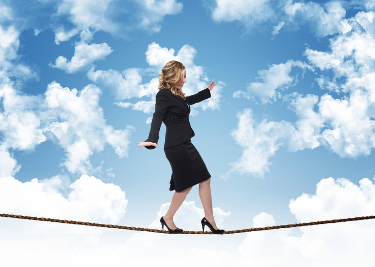 woman on rope and blue sky with clouds