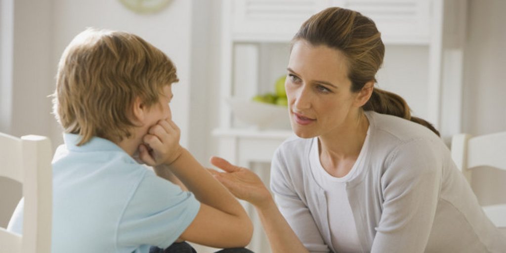 Mother having discussion with son