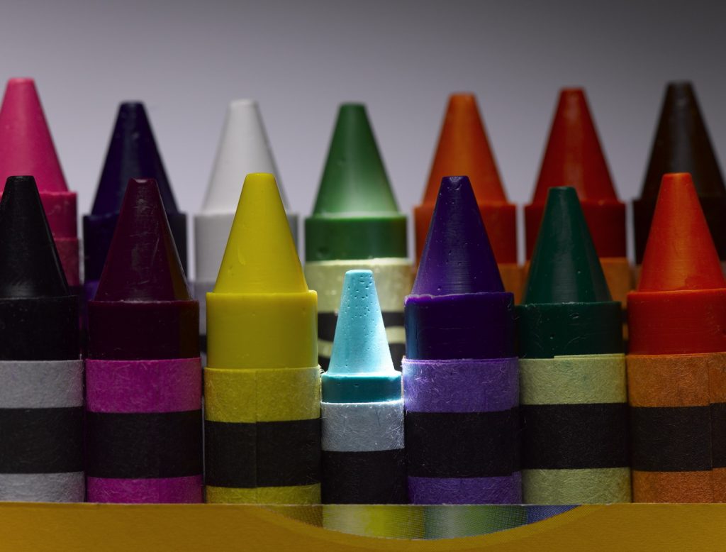 Rows of colourful crayons, close-up