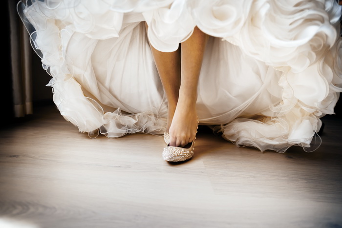 bride dresses wedding shoes. morning of the bride