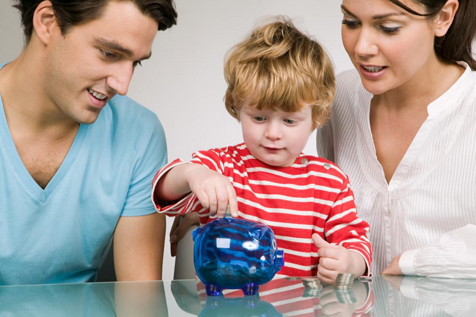 Boy and parents with piggy bank