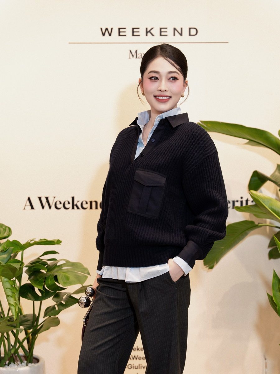 Á hậu Phương Nga ghi dấu phong cách với vẻ thanh lịch hiện đại trong áo sơ mi Acanto, áo dệt kim Vanda và quần ống đứng Salsa.