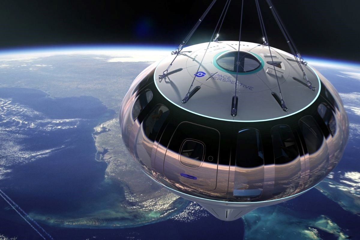 Space Perspective’s pressurised glass capsule carries guests “rising with the dawn” to the edge of space – champagne in hand as the curved horizon slowly appears beneath their feet
